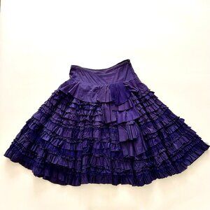 Anthropologie full circle midi skirt, ruffles and raw edge lace trims.